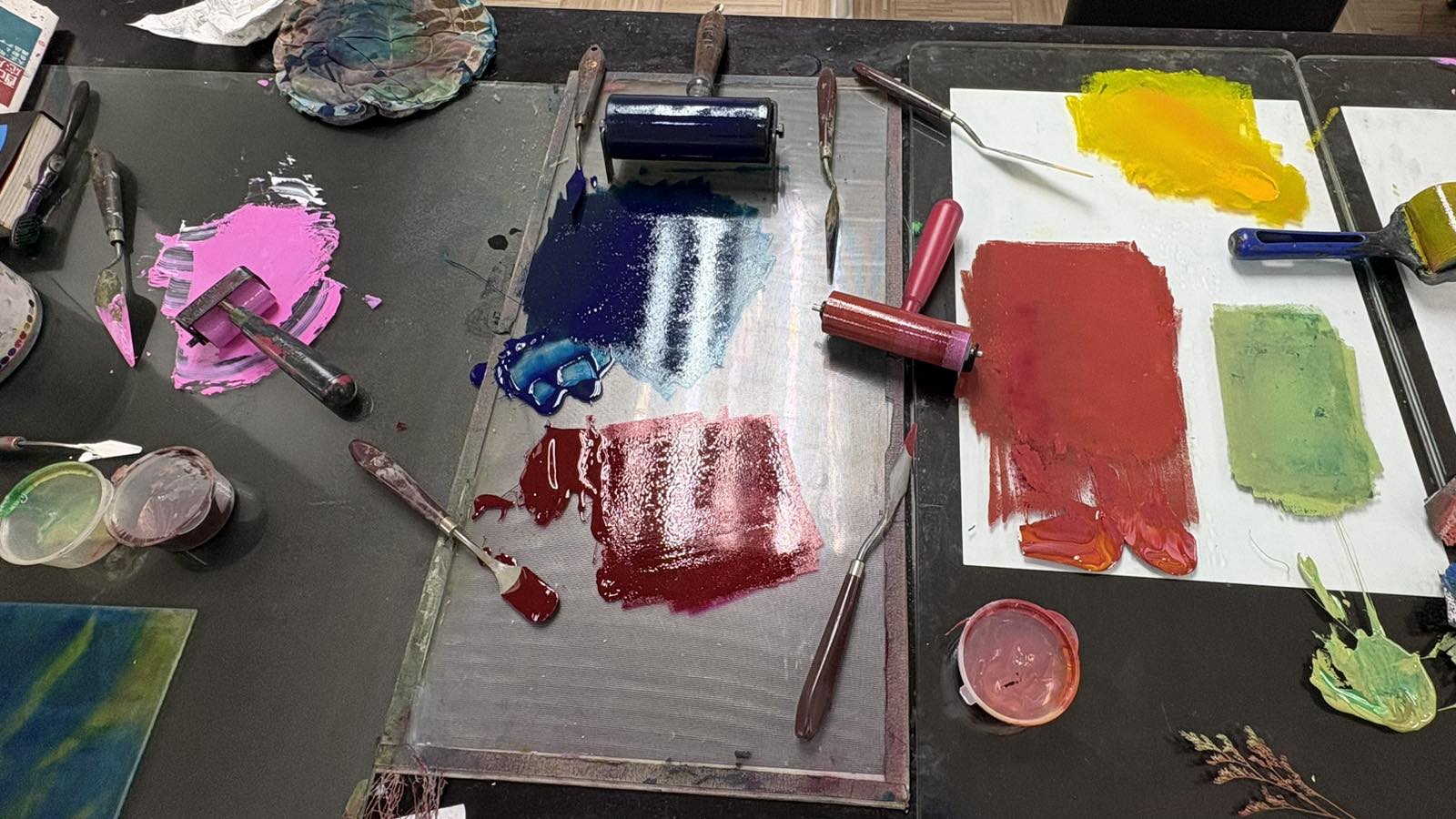 The inking station — brayers and slabs of colour