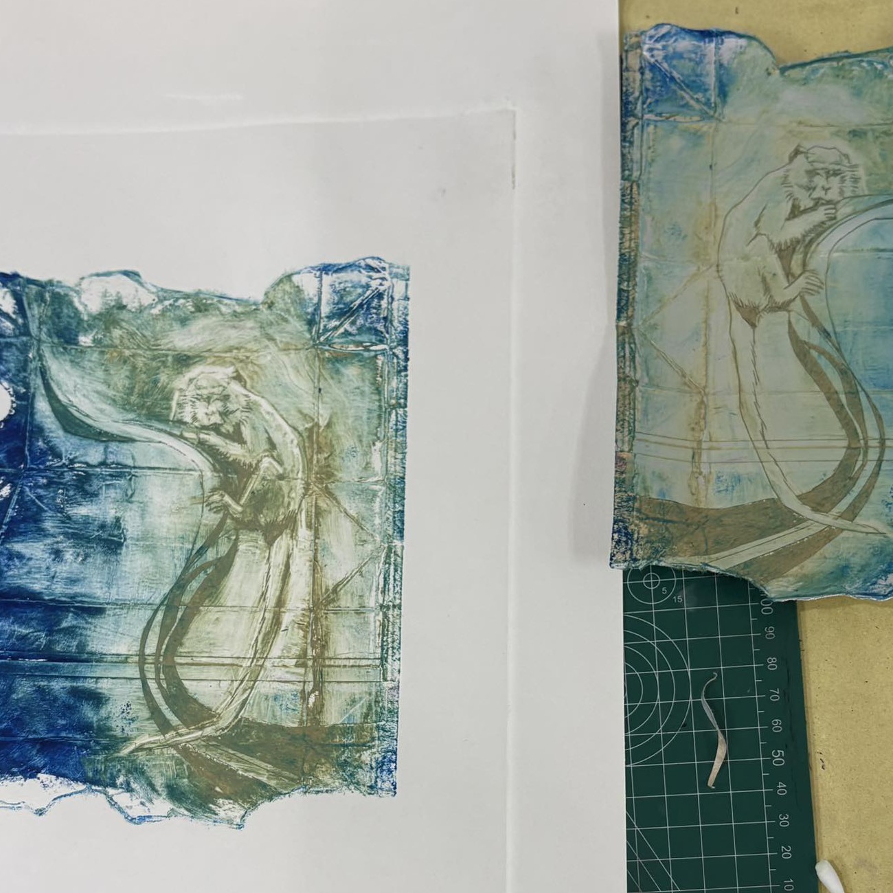 A blue-green drypoint of a monkey, beside its plate