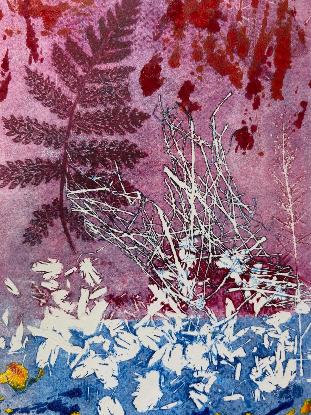 A fern printed in magenta and blue